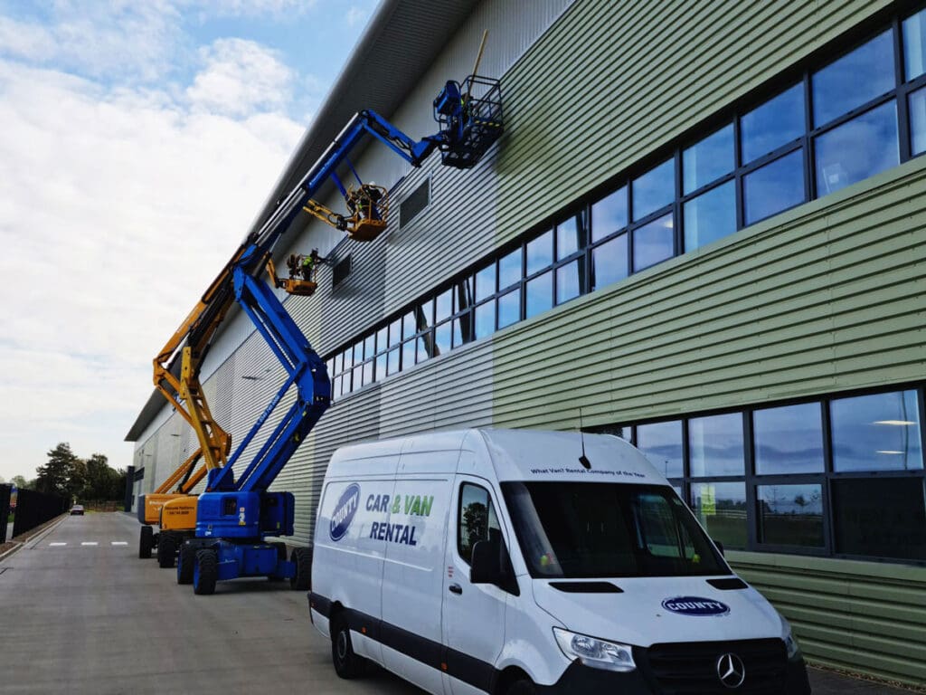 Installing colour matched Illuminated LED strips around the building.